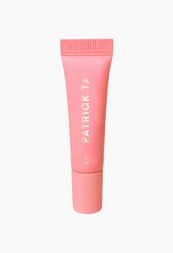 GLAM MODA Mini Major moisture smoothing lip balm in a coral pink squeeze tube with a high-shine finish.