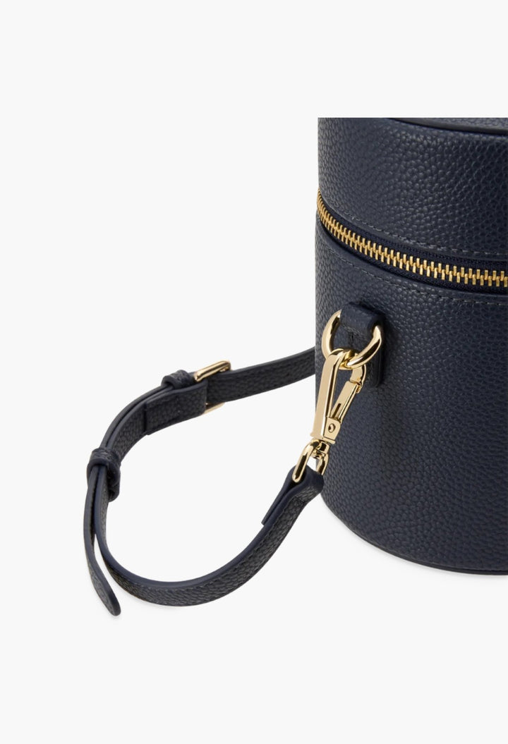 GLAM MODA navy blue vegan leather oval toiletry case with gold hardware and a detachable shoulder strap.