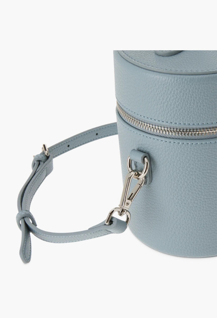 GLAM MODA oval toiletry case in light blue vegan leather with a detachable shoulder strap and silver hardware.