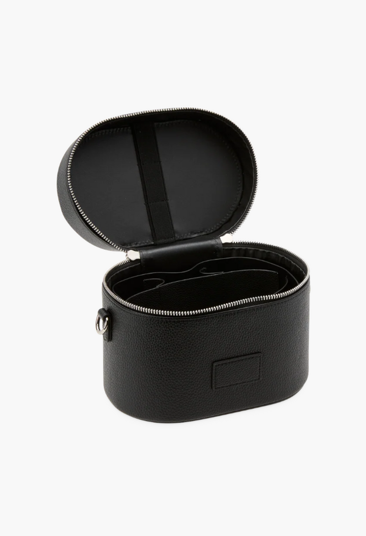 GLAM MODA black vegan leather oval toiletry case with open lid, removable divider, and brush storage elastic.