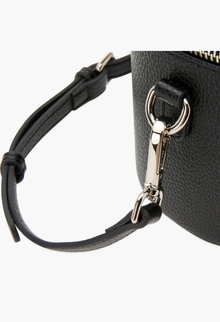 Close-up of the black vegan leather GLAM MODA oval toiletry case showing the detachable shoulder strap and hardware.