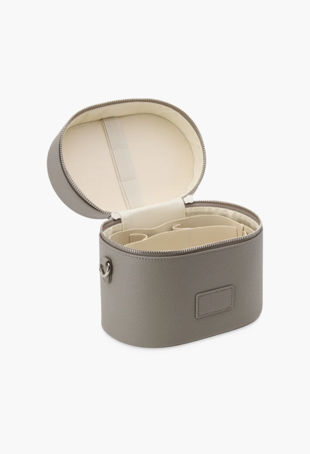 GLAM MODA oval vegan leather toiletry case in taupe with open lid, removable divider, and brush storage elastic.