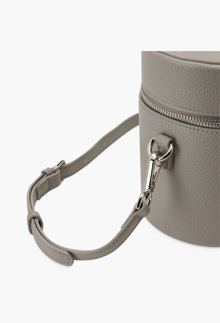 GLAM MODA oval toiletry case in grey vegan leather with a detachable shoulder strap and silver hardware detail.