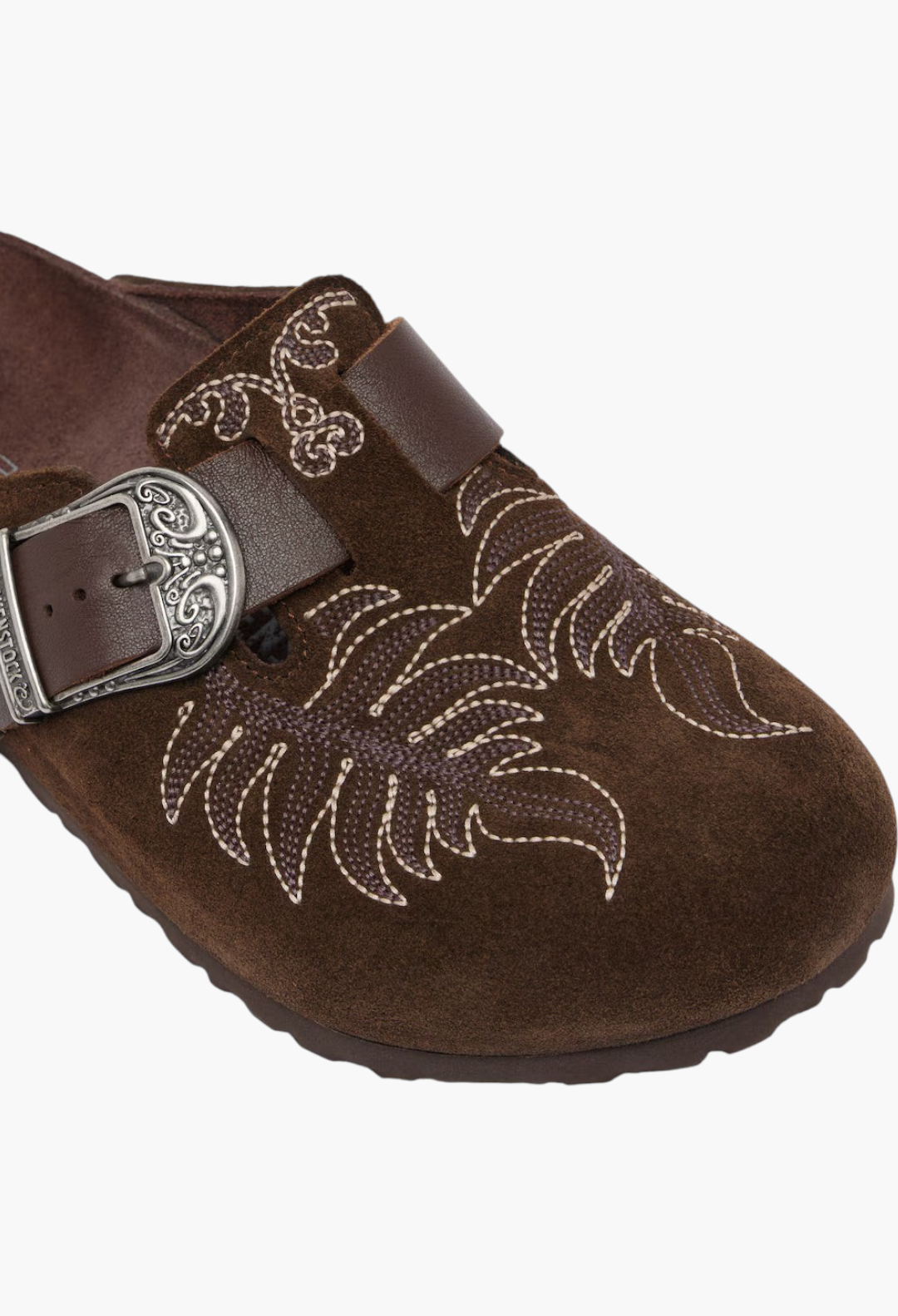 GLAM MODA brown suede Birkenstock Boston clogs featuring intricate embroidery and an engraved metal buckle detail.