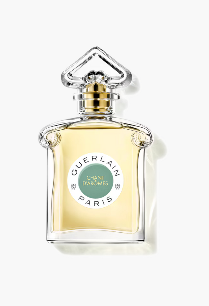 GLAM MODA Chant d'Arômes Eau de Toilette in a classic glass bottle with a green label and elegant stopper.