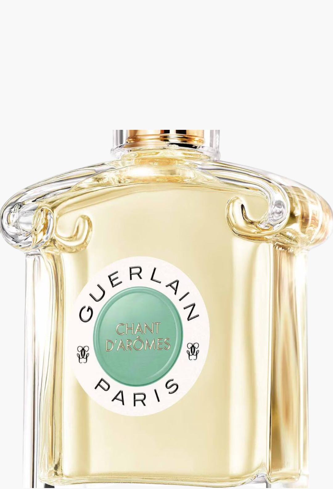 GLAM MODA Guerlain Chant d'Arômes eau de toilette in a clear glass bottle with a round green and white label.