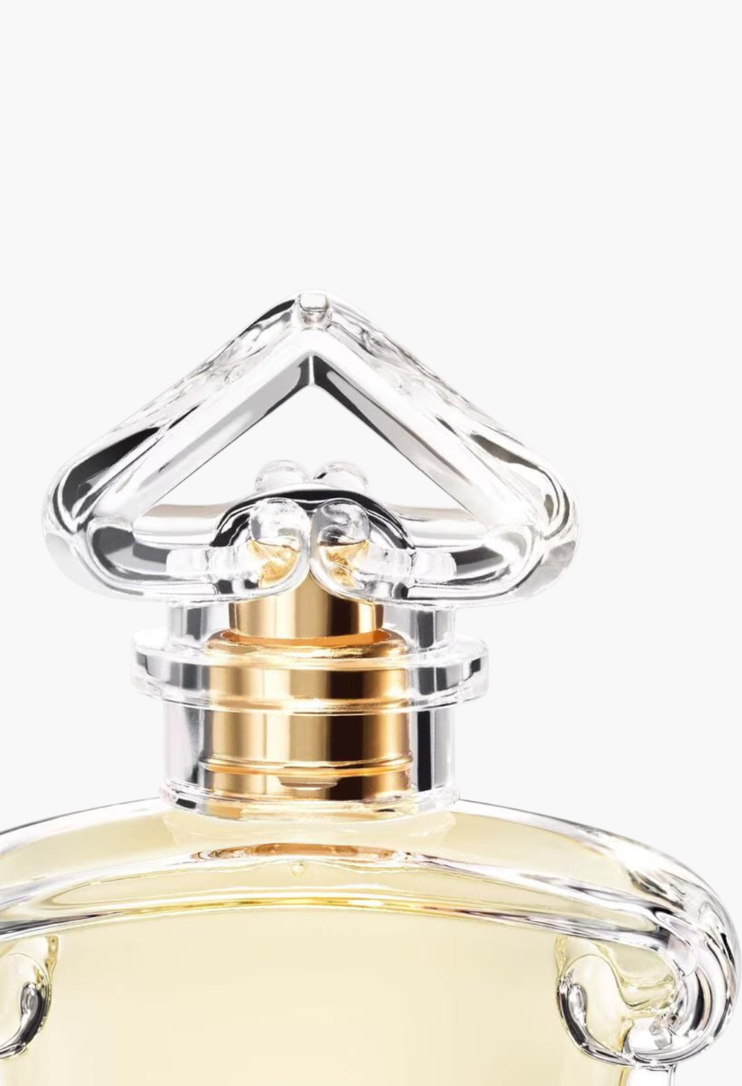 GLAM MODA Chant d'Arômes eau de toilette bottle featuring a clear glass heart-shaped stopper and gold accents.