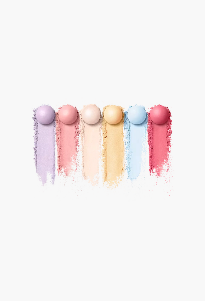 GLAM MODA Météorites setting powder pearls with colorful matte and pearlescent swatches in lavender, pink, and gold.