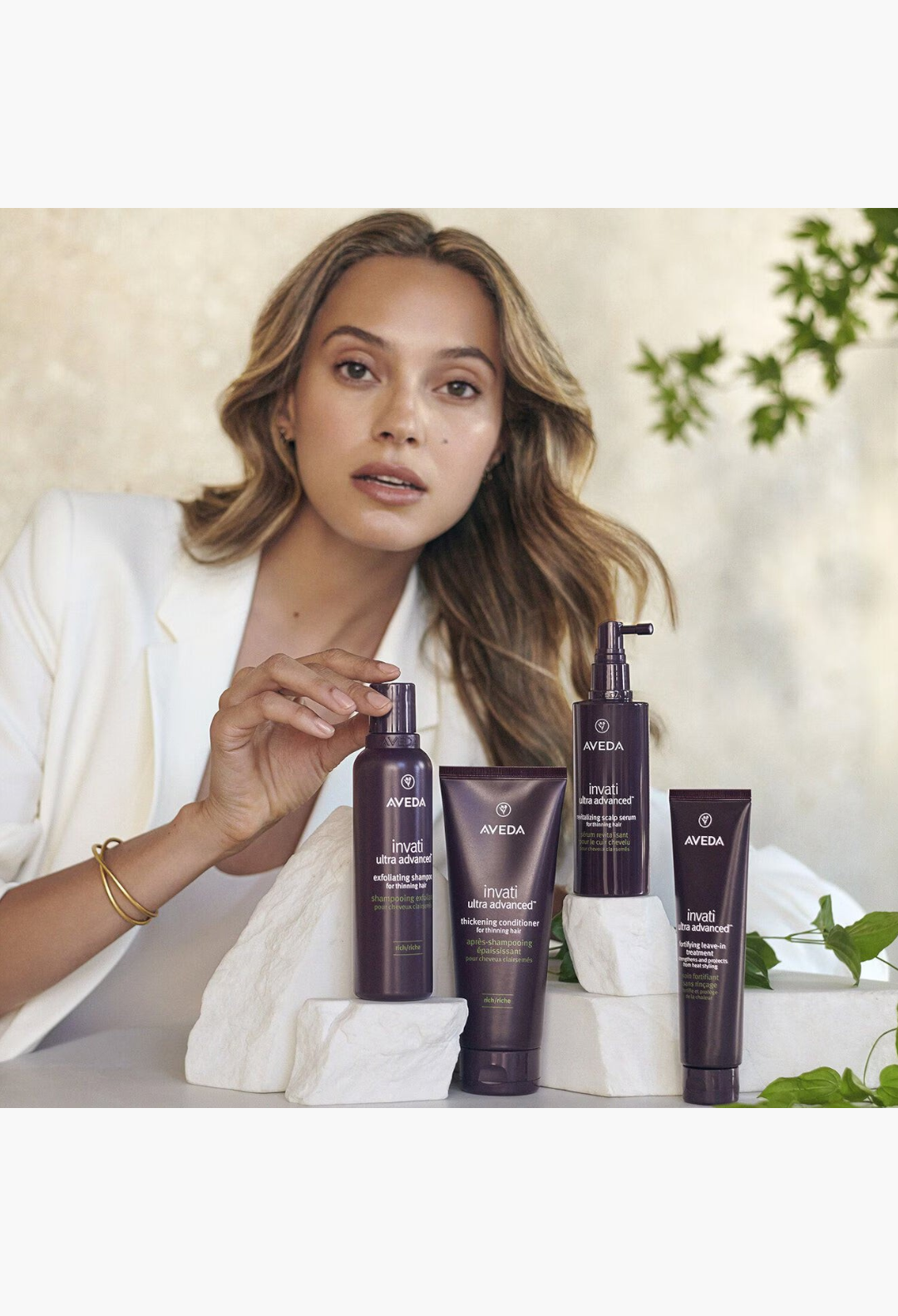 GLAM MODA Aveda Invati Ultra Advanced hair care system featuring thickening conditioner and scalp treatment bottles.