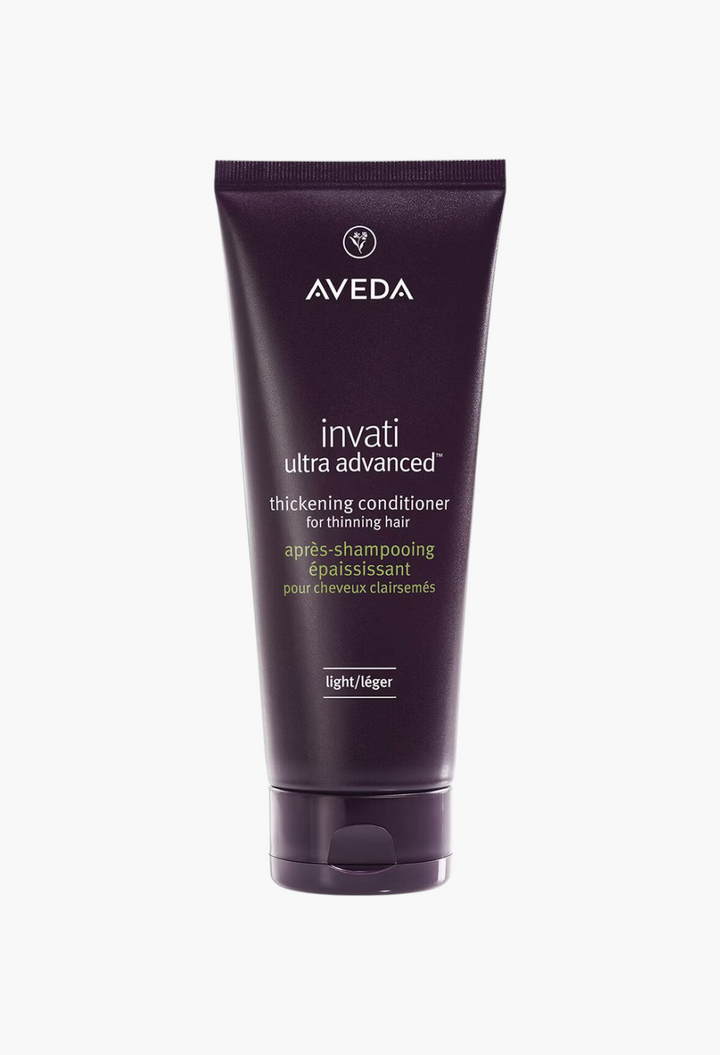 GLAM MODA Aveda Invati Ultra Advanced Thickening Conditioner Light in a dark purple squeeze tube for thinning hair.