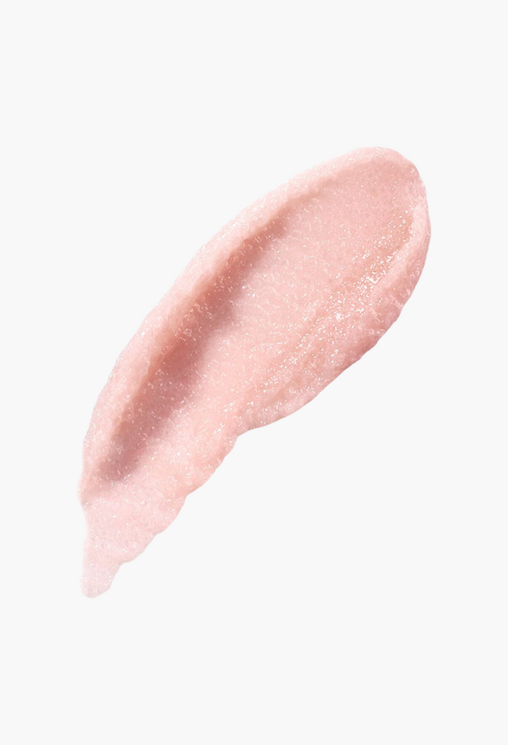 GLAM MODA The Lip Polish buffing balm swatch showing a light pink, exfoliating sugar scrub texture.