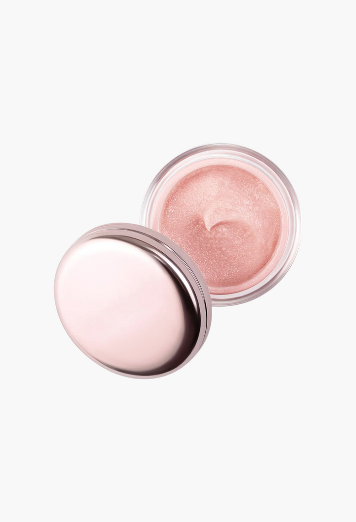GLAM MODA The Lip Polish in a small glass jar with a metallic pink lid, showing the grainy exfoliating balm texture.