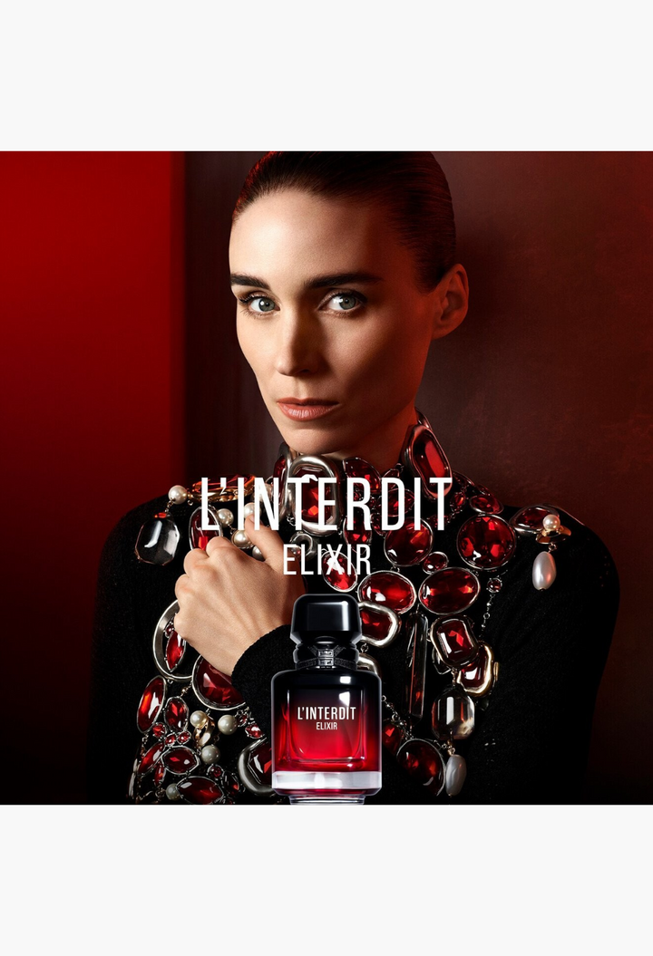 GLAM MODA L'Interdit Elixir perfume bottle featuring a deep red gradient glass design with a black cap.