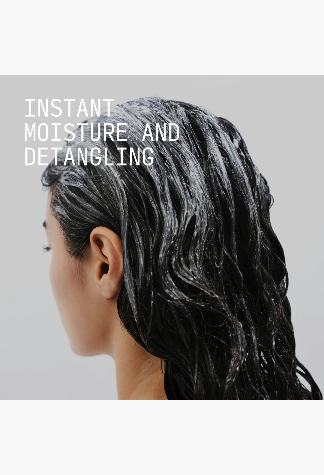 GLAM MODA hydrating conditioner applied to a woman's wet, dark hair to provide moisture and detangling benefits.
