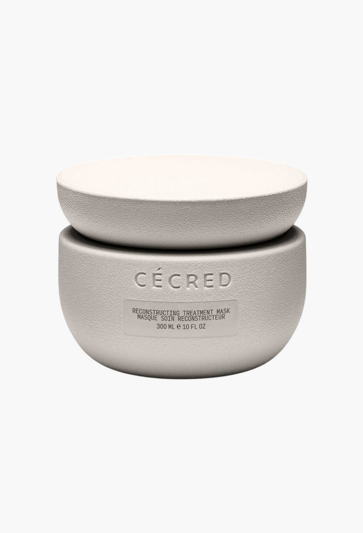 GLAM MODA Cécred Reconstructing Treatment Mask in a textured beige jar for hair repair and strengthening.