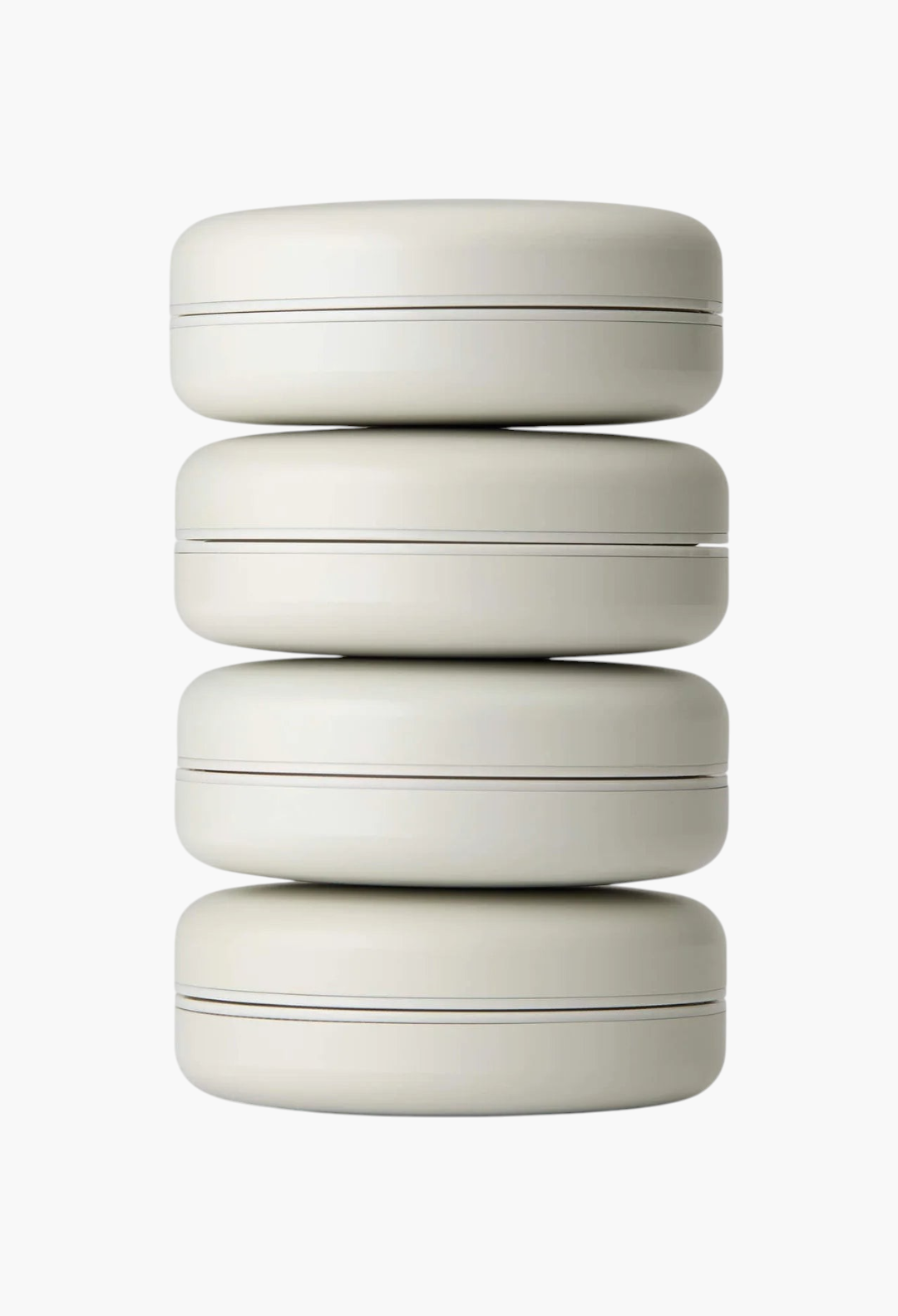 GLAM MODA Le Balm Quatre solid serum set featuring four stacked beige compact containers for skincare.