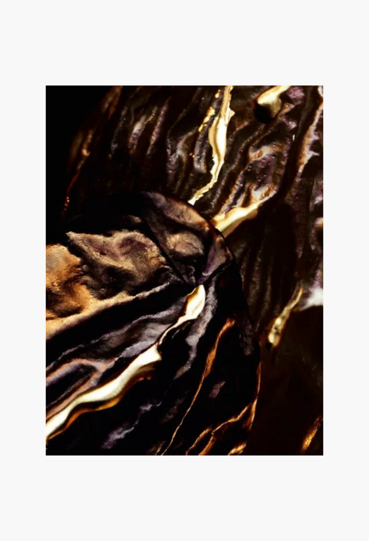 GLAM MODA Guerlain Tonka Sarrapia Extrait 75 parfum extract featuring dark textured tonka bean with gold accents