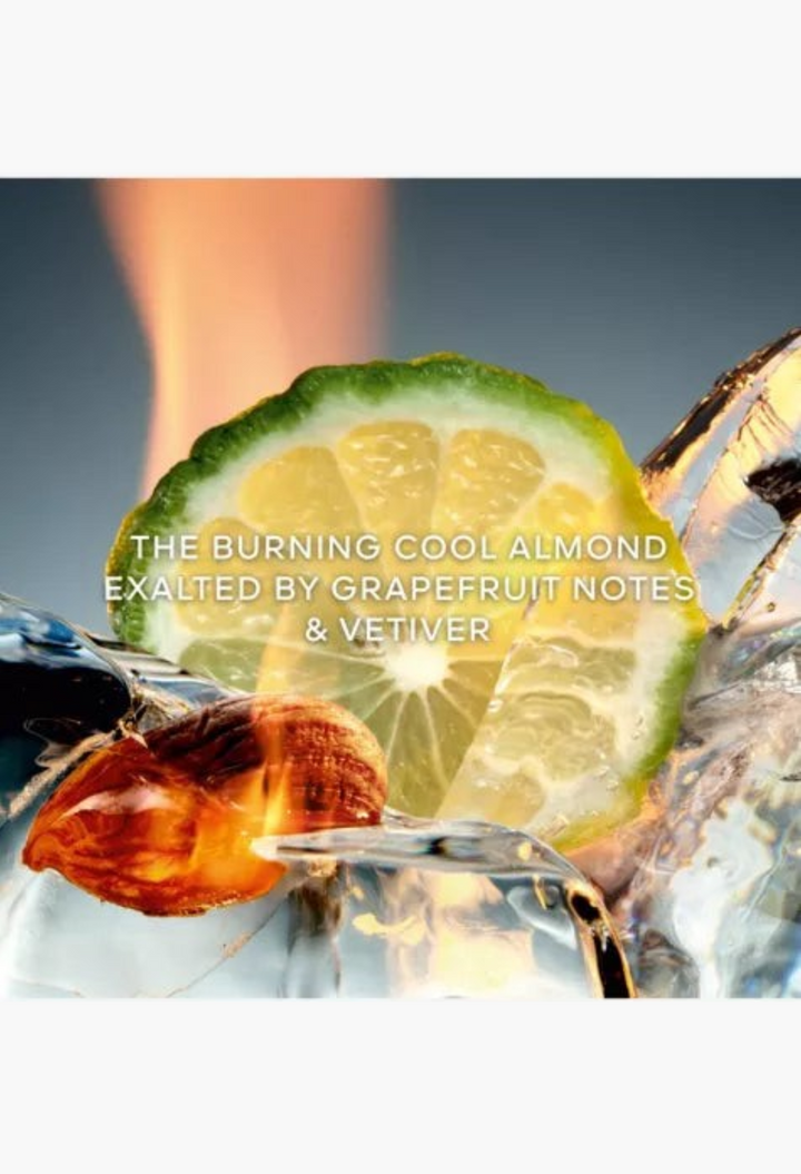 GLAM MODA L’Homme Idéal Cologne Forte featuring a fresh grapefruit slice, almond, and ice with a burning flame effect