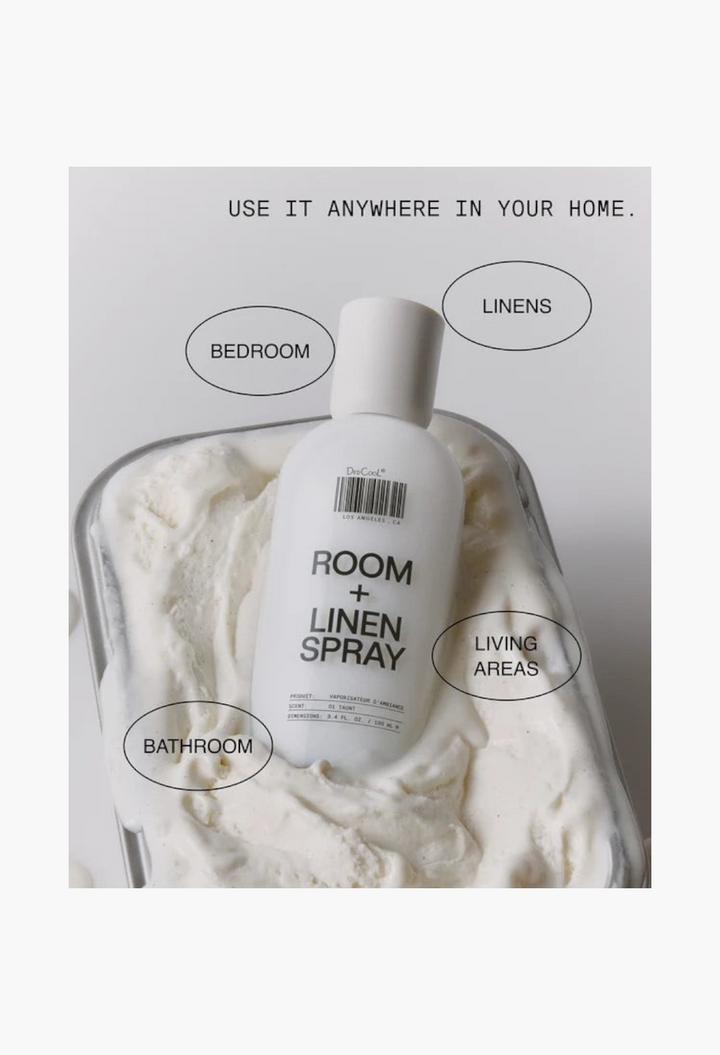 GLAM MODA 01 Taunt room and linen spray in a white glass bottle resting on a textured white surface