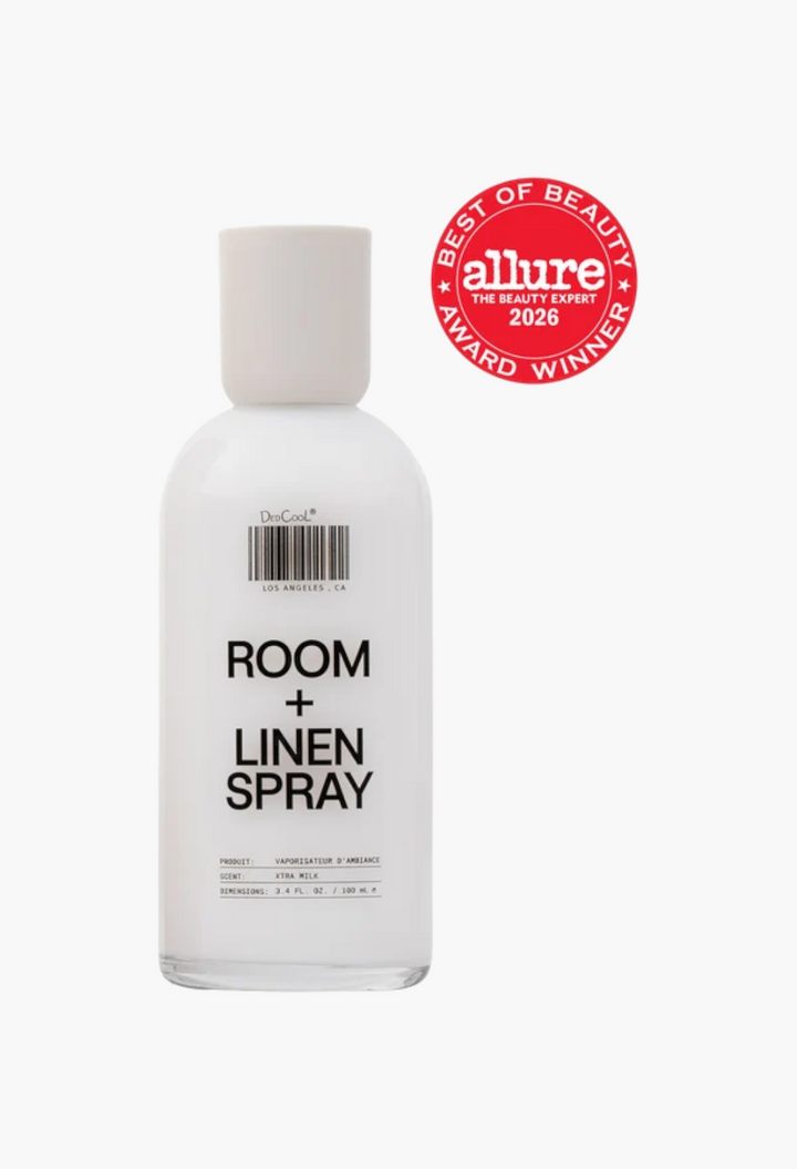 GLAM MODA Xtra Milk room and linen spray in a recyclable glass bottle with an Allure Best of Beauty award seal.