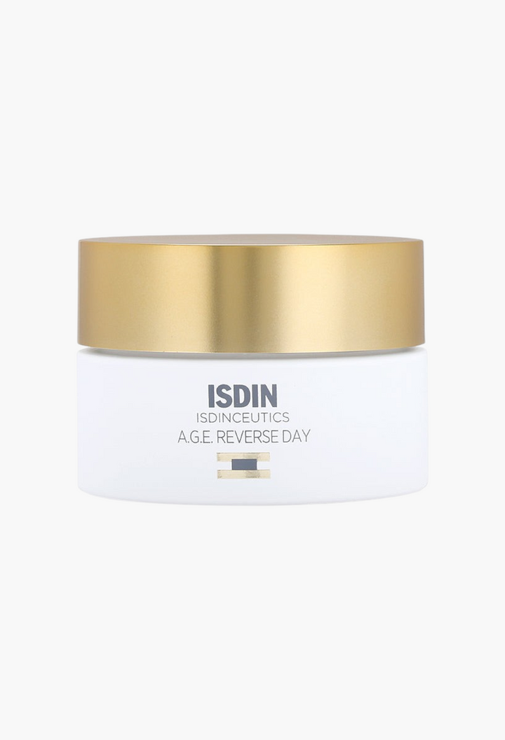 GLAM MODA Isdinceutics A.G.E. Reverse Day anti-aging face cream in a white jar with a gold lid.
