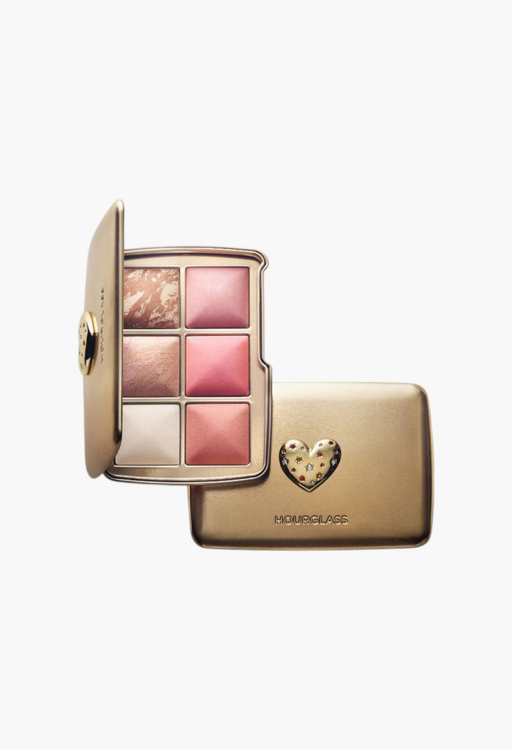 GLAM MODA Hourglass Ambient Lighting Edit Unlocked palette in a gold tin case with a heart charm and six powder shades.
