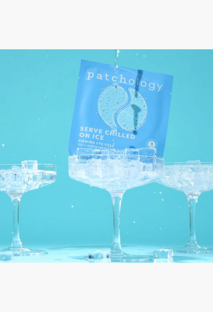 GLAM MODA Patchology Serve Chilled on Ice firming eye gel mask sachet balanced on a glass with ice cubes and water
