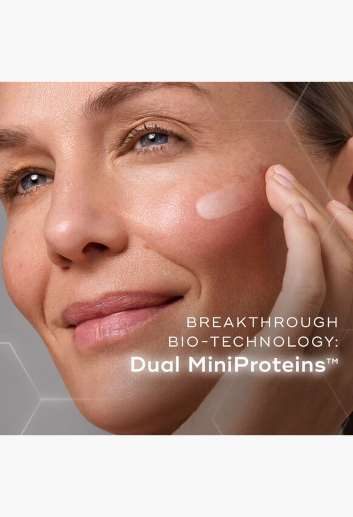 GLAM MODA Medik8 Liquid Peptides serum applied to a woman's cheek to target wrinkles and expression lines