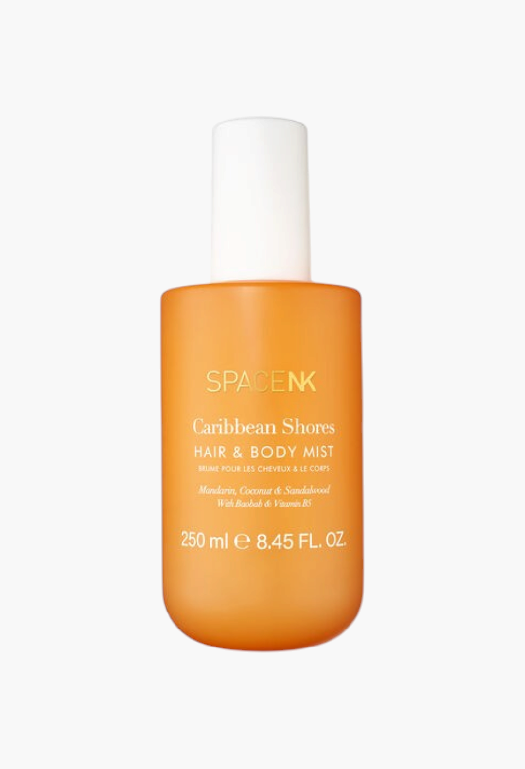 GLAM MODA Caribbean Shores hair and body mist in an orange bottle with mandarin, coconut, and sandalwood scent.