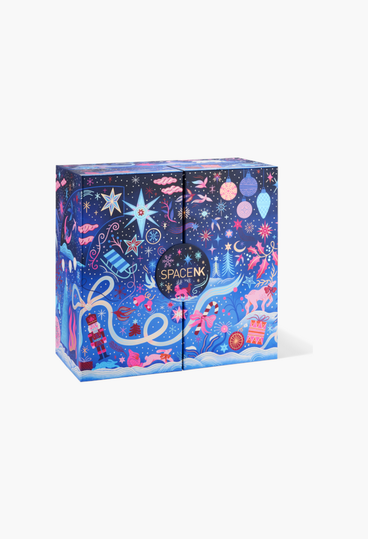 GLAM MODA beauty advent calendar in a blue box with festive holiday illustrations of stars, nutcrackers, and gifts.