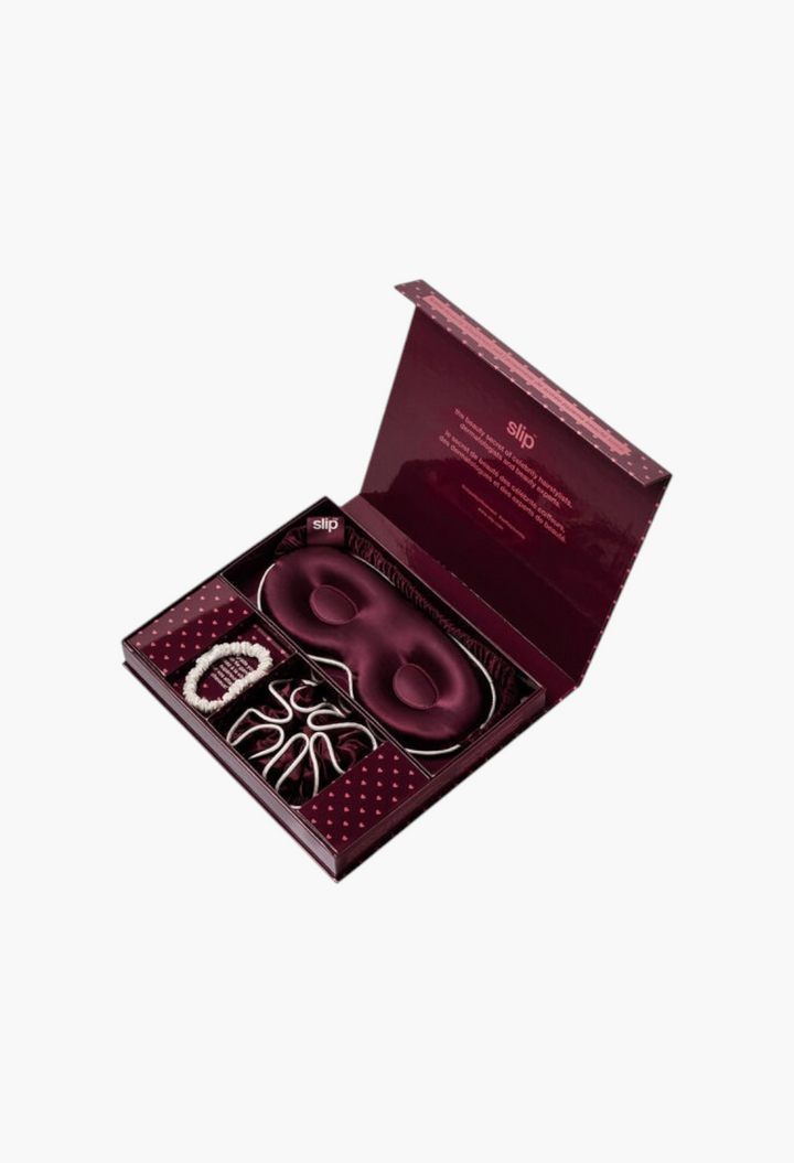 GLAM MODA Slip Pure Silk Beauty Sleepover Set in Lottie featuring a crimson contour mask and silk hair scrunchies.