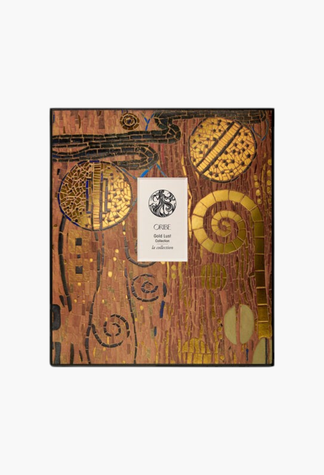 GLAM MODA Oribe Gold Lust Collection gift set featuring decorative mosaic-style packaging with gold accents.