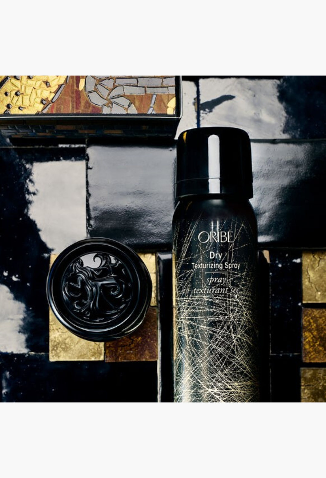 GLAM MODA Oribe Protect and Texturizing travel hair spray set featuring heat protection and volume boosting sprays.