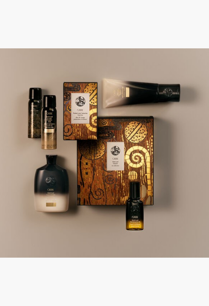 GLAM MODA Oribe hair care collection featuring Gold Lust shampoo, conditioner, hair oil, and travel styling sprays.