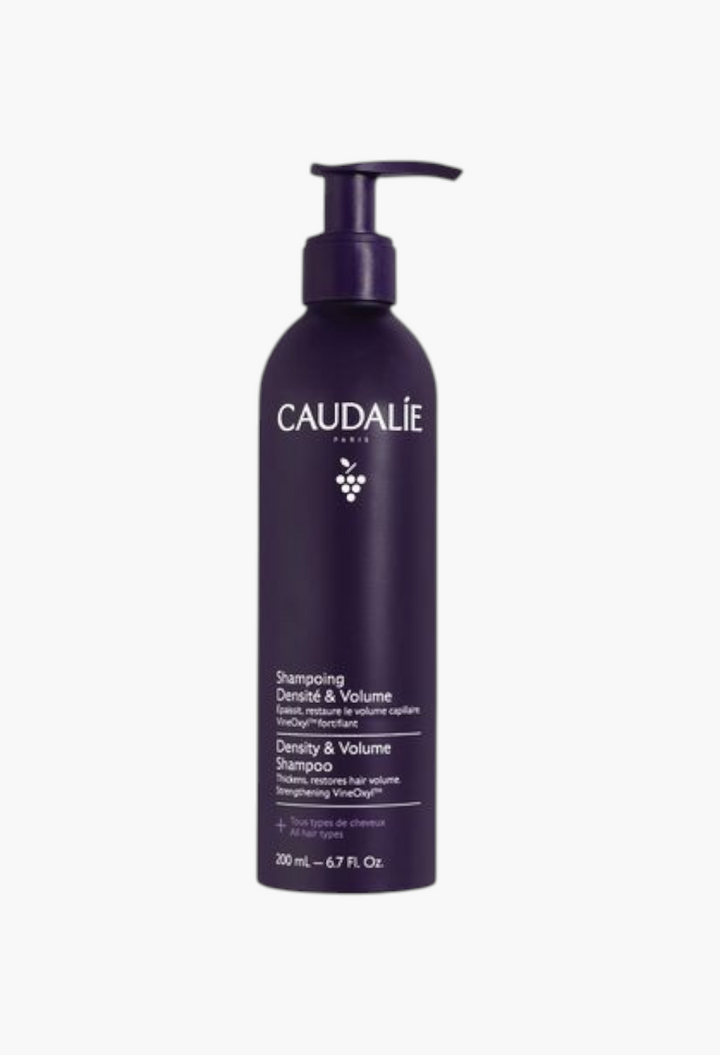 GLAM MODA Caudalie Density and Volume shampoo in a dark purple pump bottle for thicker and fuller hair