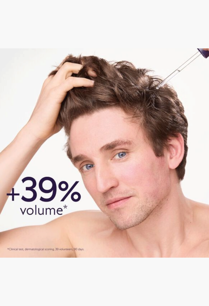 GLAM MODA anti-hair loss serum being applied to a man's scalp with a pipette for increased volume and hair density