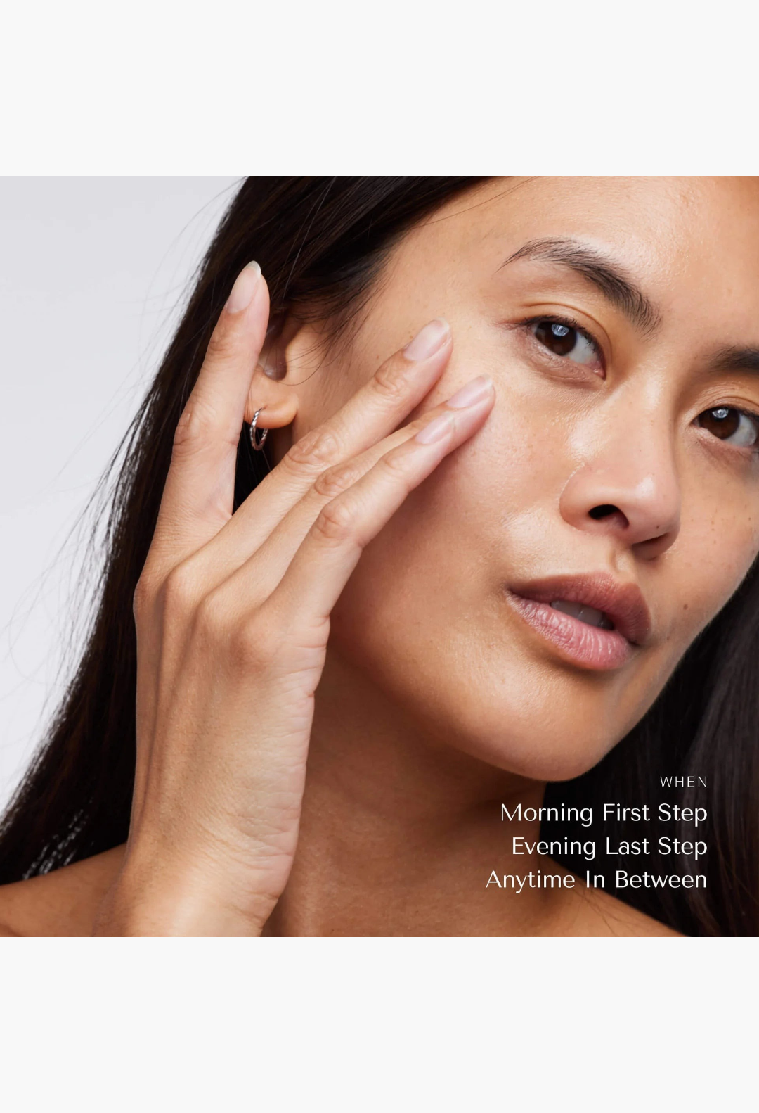 GLAM MODA Le Balm solid serum applied to the cheek of a woman to soothe sensitive skin and repair the barrier.