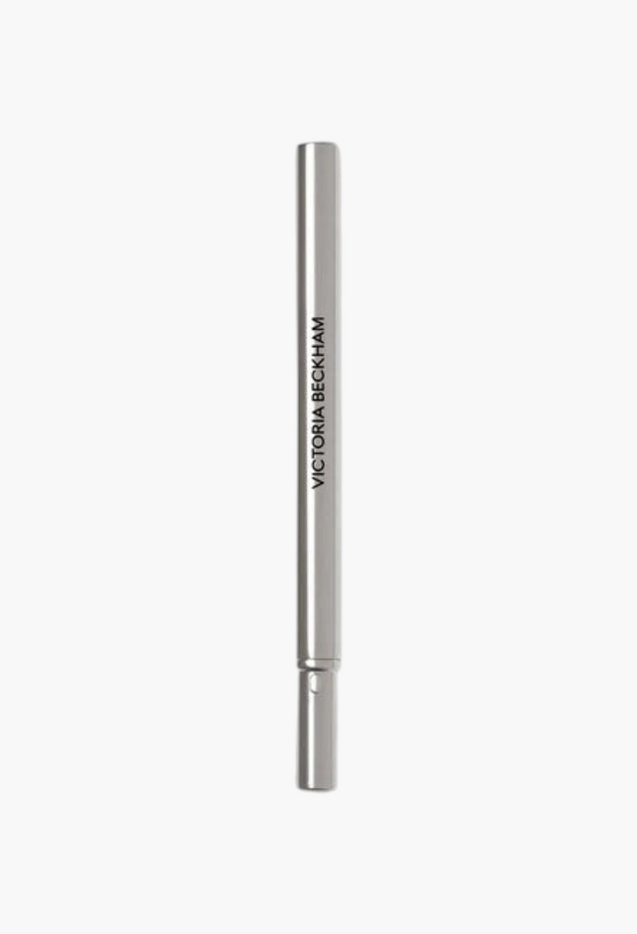 GLAM MODA Victoria Beckham Beauty Lip Definer lip pencil in a sleek silver metallic casing.