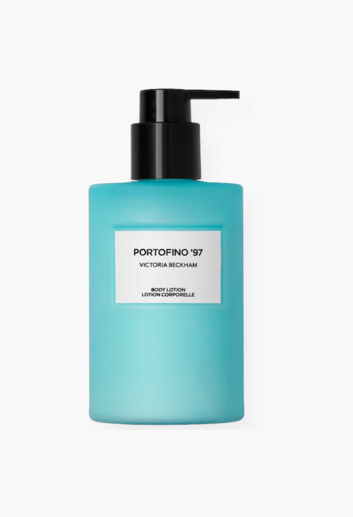GLAM MODA Portofino '97 body lotion in a signature Ligurian blue bottle with a black pump dispenser.
