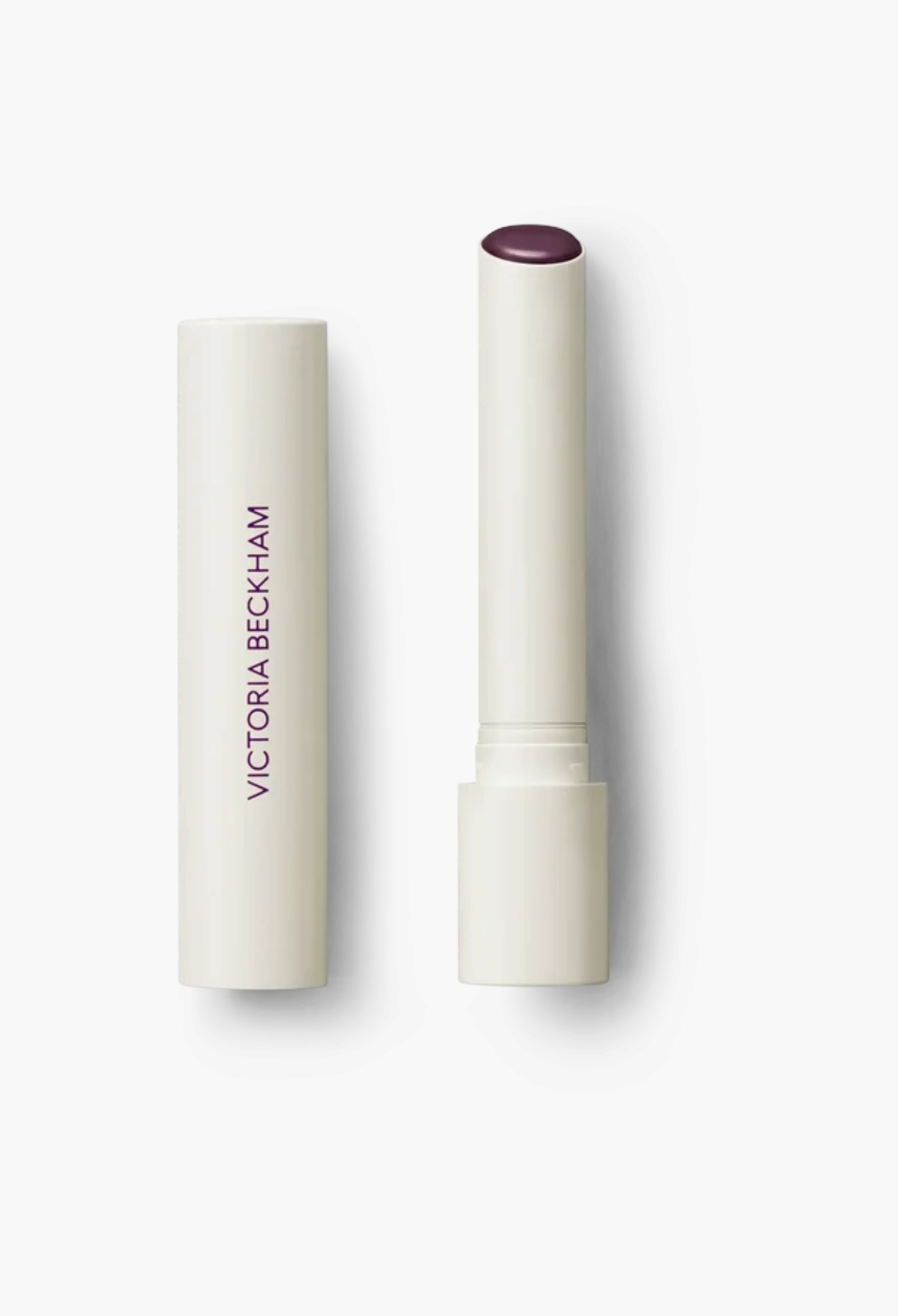 GLAM MODA Posh Balm Nourishing Lip Shine in a sleek cream-coloured twist-up stick with a deep berry tinted balm.