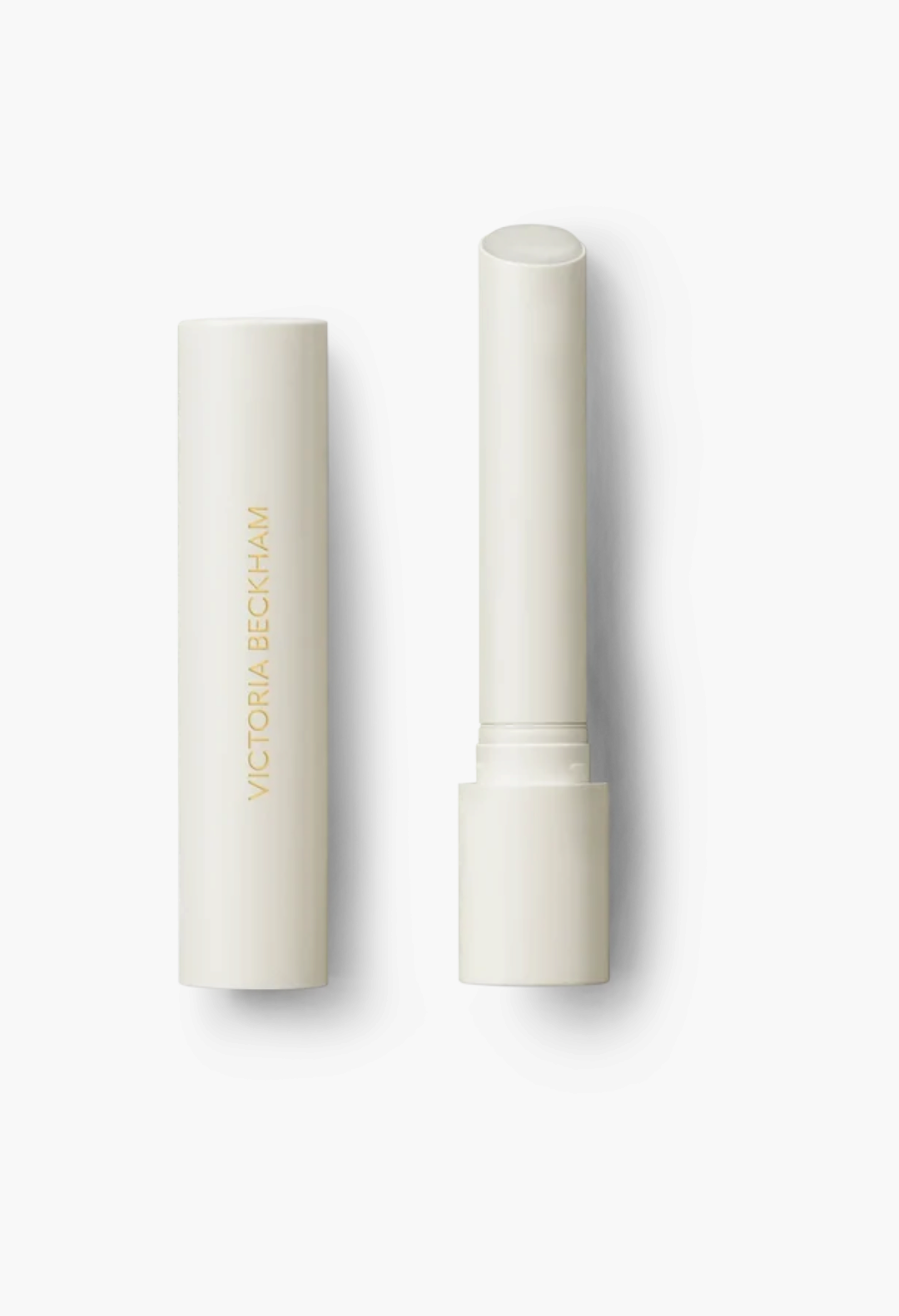 GLAM MODA Posh Balm Nourishing Lip Shine in a sleek, minimalist off-white twist-up tube with gold lettering.