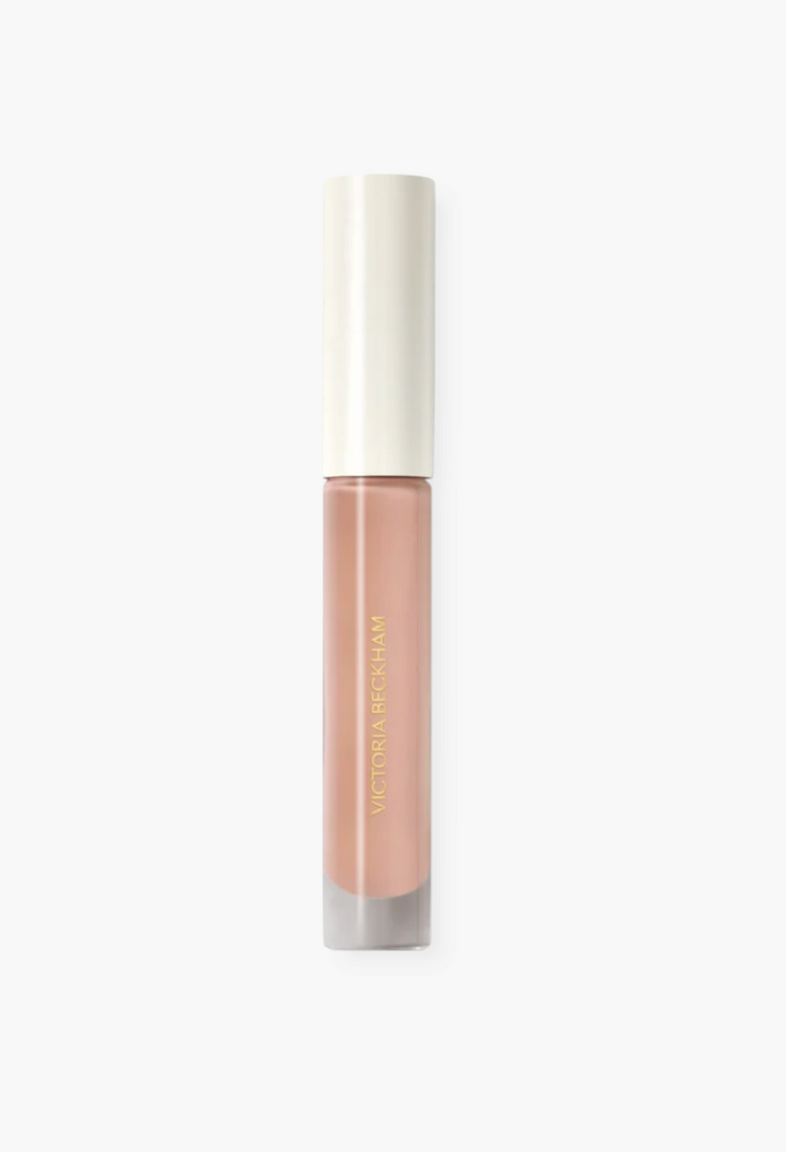 GLAM MODA Posh Gloss high-shine lip gloss in a neutral nude shade with a sleek applicator tube