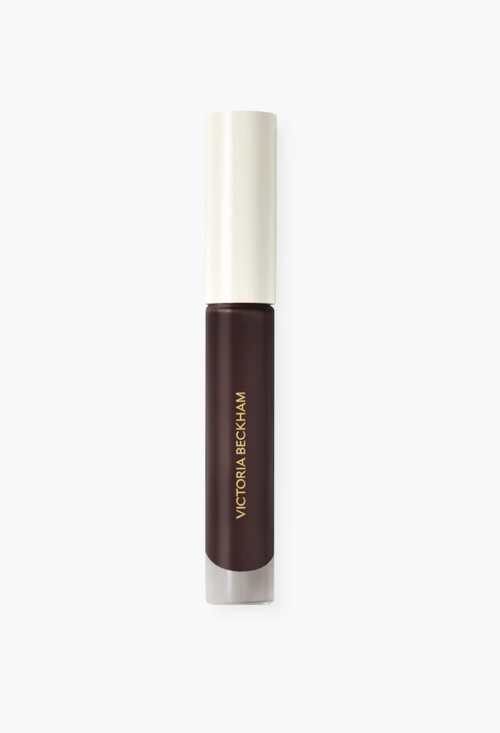 GLAM MODA Posh Gloss in a deep brown shade with a sleek applicator and mirror-like high-shine finish.