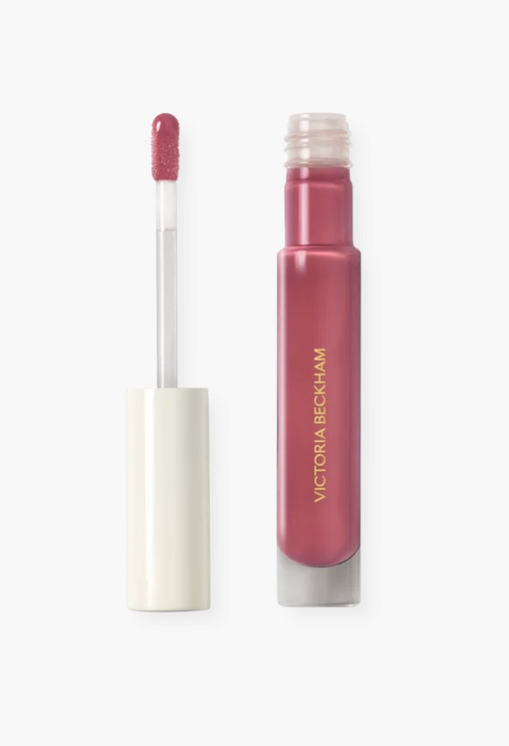 GLAM MODA Posh Gloss high-shine lip gloss in a mauve-pink shade with a doe-foot applicator and frosted glass tube.