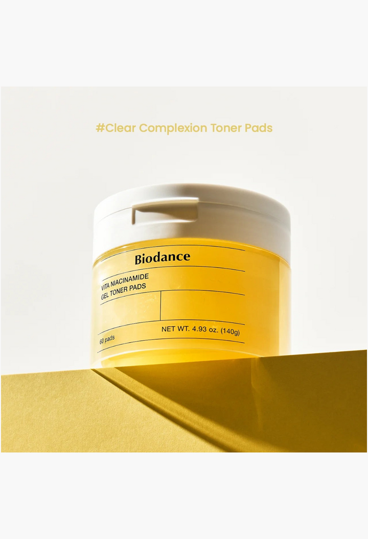 GLAM MODA Biodance Vita Niacinamide Gel Toner Pads in a yellow translucent jar for brightening and skin texture.