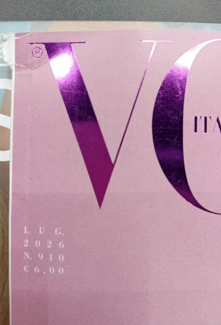 GLAM MODA Vogue Italia July 2026 magazine cover featuring a vibrant pink background and metallic purple lettering.
