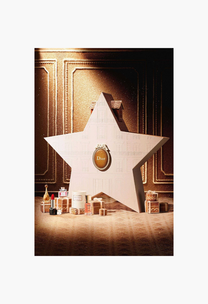 GLAM MODA Dior Le 30 Montaigne star-shaped advent calendar with miniature fragrances, lipstick, and candle set.