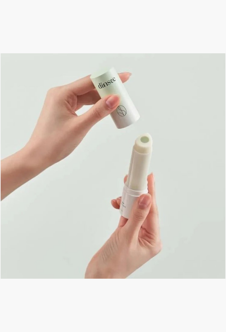 GLAM MODA Dinsee vegan 3-in-1 sunscreen stick with SPF50+ PA++++ being opened by hands for easy daily application.