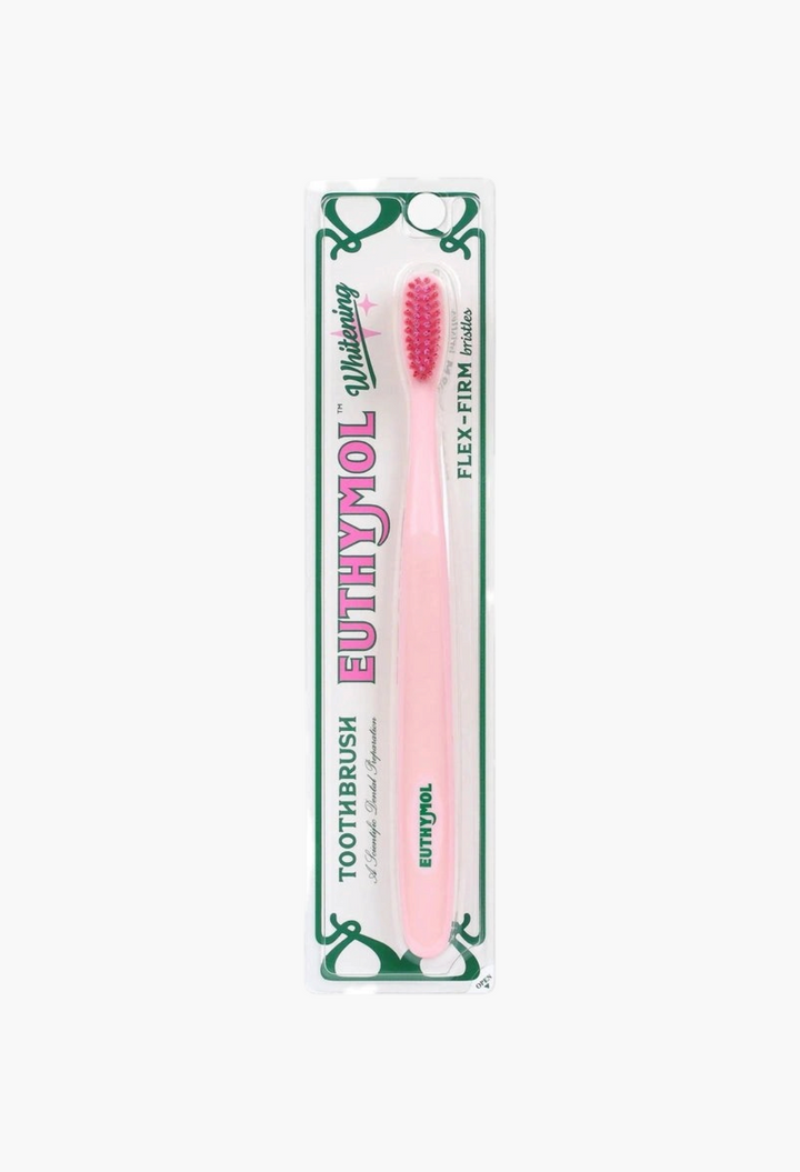 GLAM MODA Euthymol whitening toothbrush with a pink handle and red flex-firm bristles in original retail packaging
