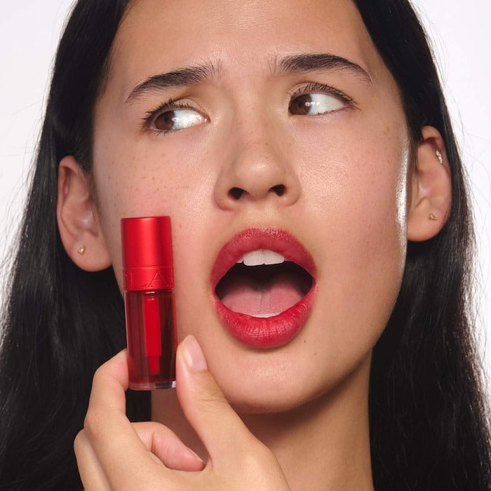 Hydrating Water Lip Stain next to water splash – GLAM MODA